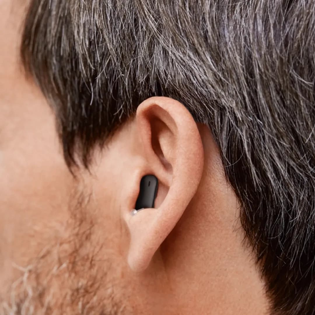 Completely in canal hearing aids (CIC) worn by a person, cosmetic view shows of how the hearing aid is fitting