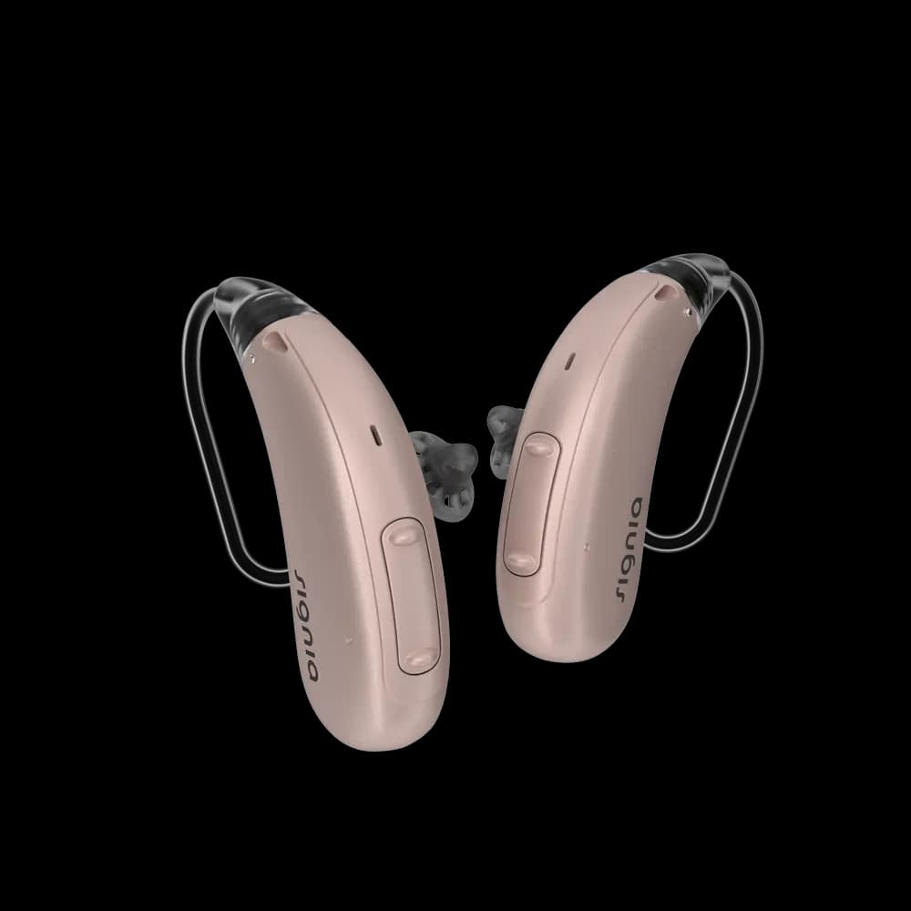 Two beige behind the ear hearing aids with ear hooks. The brand name "Signia" is visible on each device.